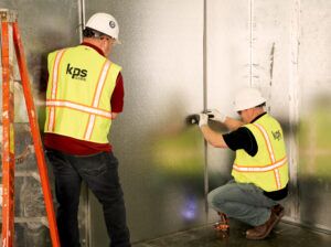 KPS service technicians restoring a walk-in