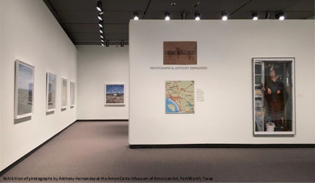 art gallery exhibit with paintings on the wall
