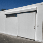 Outdoor metal build for equipment with commercial metal doors