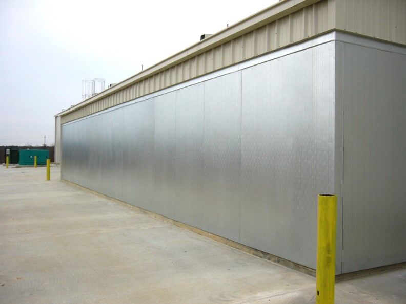 Metal outdoor walk-in used to store temperature controlled items in an outdoor walk-in freezer