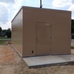 Outdoor metal shelter for equipment enclosure such as utility equipment