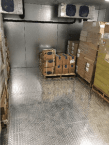 Interior of walk-in showcasing metal walk-in floor