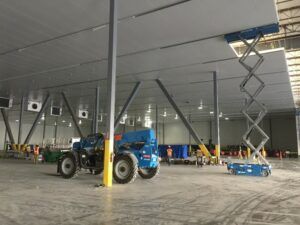 Large warehouse under construction with imp panels being installed